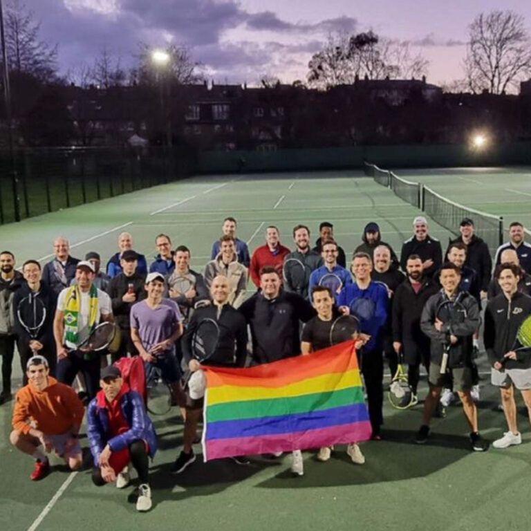 Group of people from South London Smashers holding a pride flag