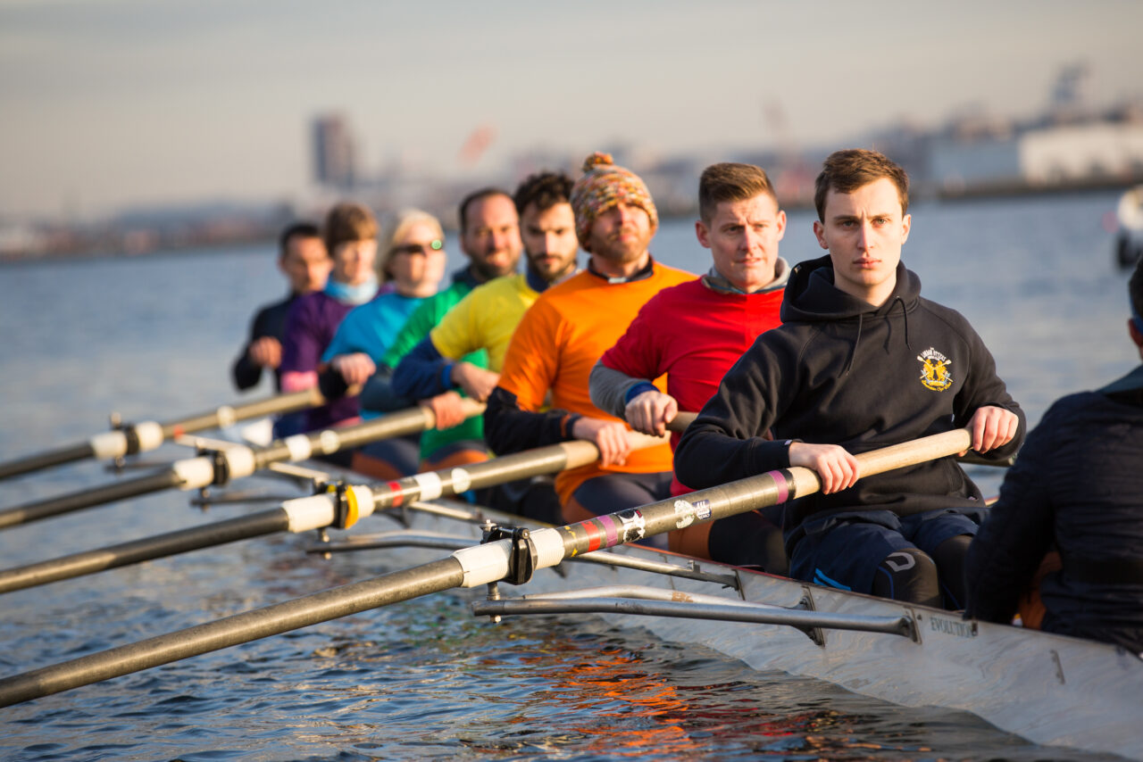 Group of rowers in a boat on the water